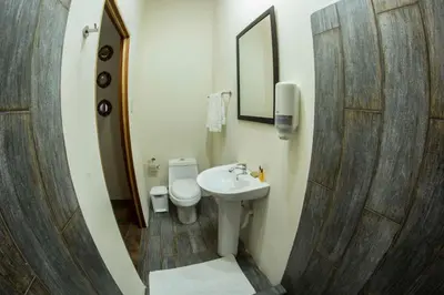 a bathroom with a sink and a toilet at Villas Fernanda #2 in Fortuna
