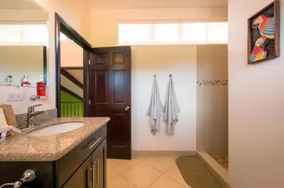 a bathroom with a sink and a shower at Cabo Velas Estates 30 in Matapalo
