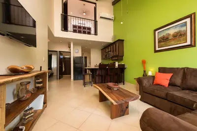 a living room with a couch and a table at Cabo Velas Estates 30 in Matapalo