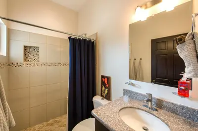 a bathroom with a sink and a toilet and a shower at Cabo Velas Estates 30 in Matapalo