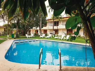 a swimming pool in front of a hotel at Samara Beach Hotel in Sámara