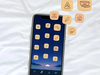 an iphone laying on a bed with icons on it at Sleep Inn Paseo Las Damas in San José