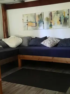 a bed with two pillows on it in a room at Casa SILURI in Santa Teresa Beach