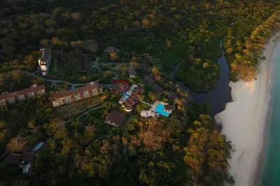 an aerial view of a resort next to a river at W Costa Rica Resort – Playa Conchal in Playa Conchal