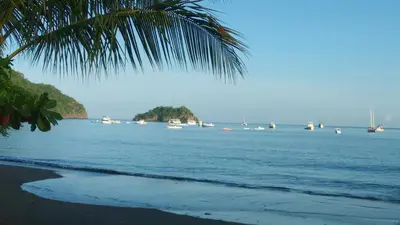 a view of a beach with boats in the water at Coco Beach Home in Coco