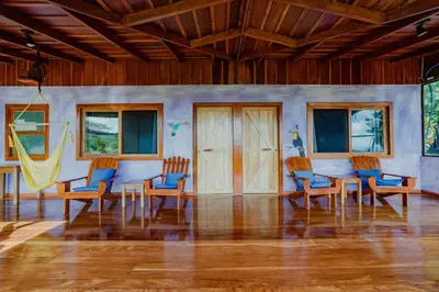 a painting of a room with chairs and tables at Mystica in Naranjos Agrios