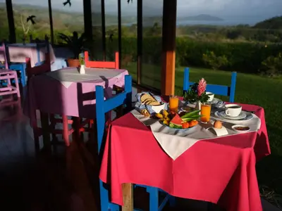 a table with a bowl of fruit on it at Mystica in Naranjos Agrios