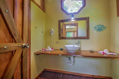 a bathroom with a sink and a mirror at Mystica in Naranjos Agrios