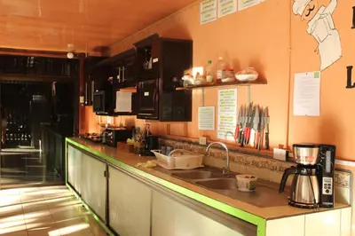 a kitchen with a sink and a counter top at Hostalito El Greco in Bagaces