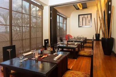 a room with a row of tables with wine glasses at Occidental Papagayo - Adults Only All Inclusive in Papagayo, Guanacaste