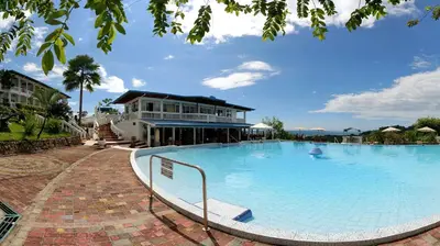 a large swimming pool in front of a building at Cristal Ballena Boutique Hotel & Spa in Uvita