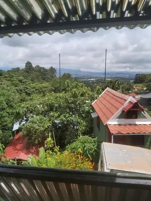 a view from the balcony of a house at Hotel Monte Campana Heredia in Birrí