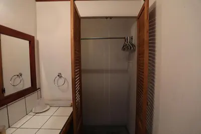 a shower with a glass door in a bathroom at Tierra Magica B&B and Art Studio in San José
