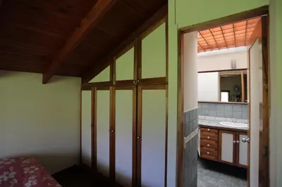 a bathroom with a sink and a mirror at Tierra Magica B&B and Art Studio in San José