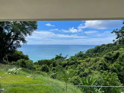 a view of the ocean from a house at Casitas Sollevante Boutique Hotel in Montezuma