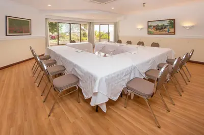 a large conference room with a large table and chairs at Hotel Bougainvillea San José in Santo Domingo