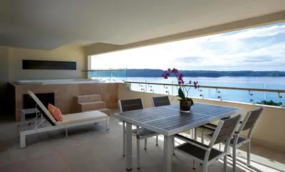 a dining room with a table and a view of the water at Planet Hollywood Costa Rica by Royalton, An Autograph Collection All-Inclusive Resort in Papagayo, Guanacaste
