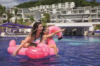 a woman and a girl on an inflatable at Planet Hollywood Costa Rica by Royalton, An Autograph Collection All-Inclusive Resort in Papagayo, Guanacaste
