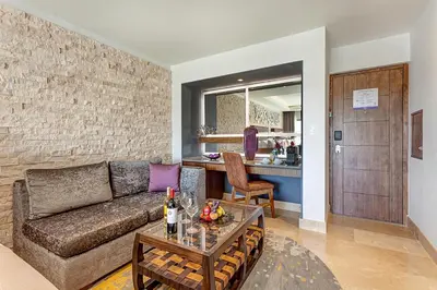a living room with a couch and a table at Planet Hollywood Costa Rica by Royalton, An Autograph Collection All-Inclusive Resort in Papagayo, Guanacaste