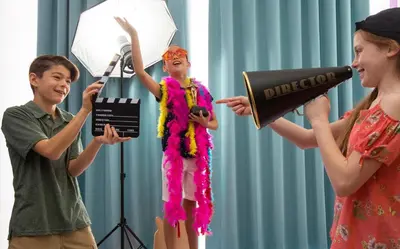 a boy and a girl singing in front of a microphone at Planet Hollywood Costa Rica by Royalton, An Autograph Collection All-Inclusive Resort in Papagayo, Guanacaste