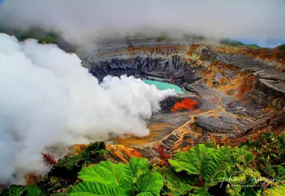 an aerial view of a volcano with clouds around it at Hotel Mango Valley in Grecia