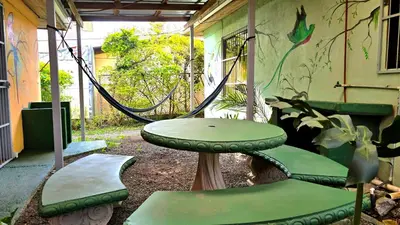 a hammock in a back yard with a swing at Casa Cattleya - Monteverde, Costa Rica in Monteverde Costa Rica