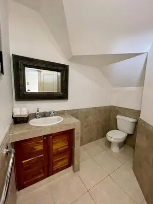 a bathroom with a sink and a toilet at Costa Riki Apartments in Santa Teresa Beach