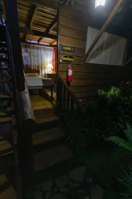 a staircase leading to a house with a fire hydrant at Vista Turrialba Lodge in Turrialba