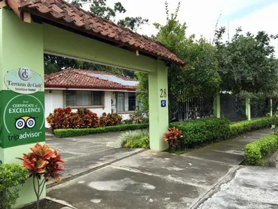 a building with a sign in front of it at Terrazas de Golf Boutique Hotel in San José