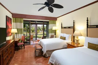 a hotel room with two beds and a balcony at JW Marriott Guanacaste Beach Resort in Tamarindo
