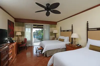 a bedroom with two beds and a ceiling fan at JW Marriott Guanacaste Beach Resort in Tamarindo