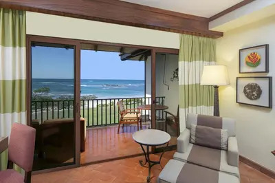 a living room with a view of the ocean at JW Marriott Guanacaste Beach Resort in Tamarindo