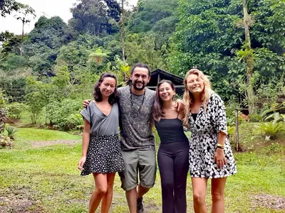 a man and two women posing for a picture at Cecropia Ecolodge in Fortuna