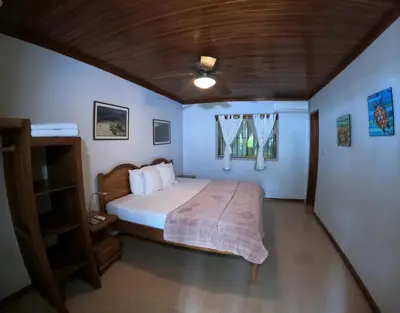 a bedroom with a bed and a window at Casa Cecilia Beach Front in Santa Teresa Beach