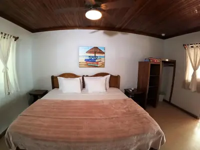 a bedroom with a large bed in a room at Casa Cecilia Beach Front in Santa Teresa Beach