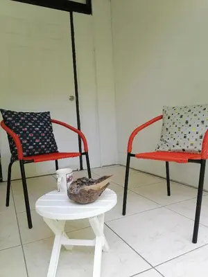 two chairs and a table with a bowl on a table at Casa Taupe in Carrillo