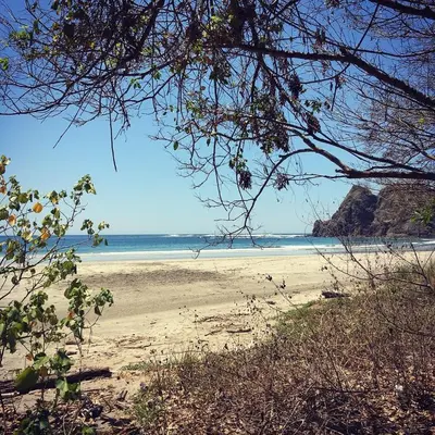 a view of a beach with the ocean in the background at Casa Taupe in Carrillo