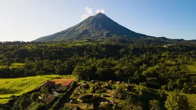 an aerial view of a volcanic mountain with houses at Hotel Campo Verde in Fortuna