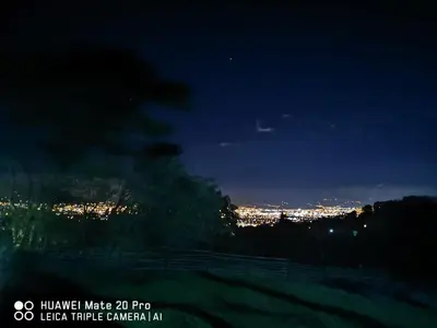 a view of a city at night with lights at Cabaña Mountain View in Heredia