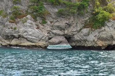a cave in the side of a rocky cliff at Mapi's House in Paquera