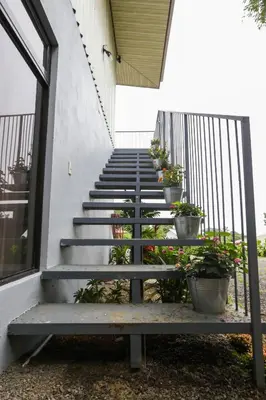 a set of stairs with potted plants on them at Apartamento Lantana ,Monteverde con Aire Acondicionado y Lavanderia in Monteverde Costa Rica