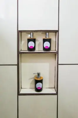 a shelf with three candles on it at Apartamento Lantana ,Monteverde con Aire Acondicionado y Lavanderia in Monteverde Costa Rica