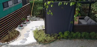 a patio with a black cover and some plants at Apartamento Lantana ,Monteverde con Aire Acondicionado y Lavanderia in Monteverde Costa Rica