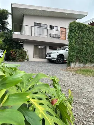a car parked in front of a house at Apartamento Lantana ,Monteverde con Aire Acondicionado y Lavanderia in Monteverde Costa Rica