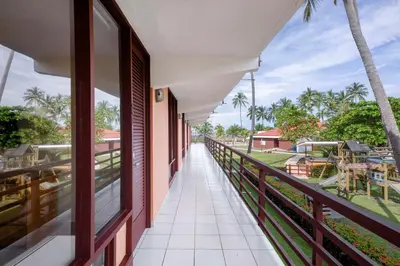 a balcony with a view of a golf course at Best Western Jaco Beach All Inclusive Resort in Jacó