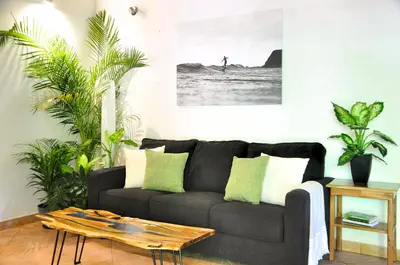 a living room with a couch and a table at Pazifico Villas in Playa Avellana