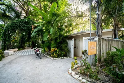 a motorcycle parked in front of a house at Casa Keshet in Santa Teresa Beach
