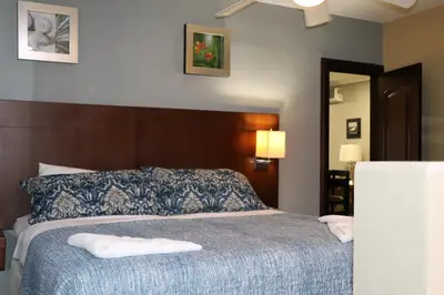 a bedroom with a bed with two towels on it at 12B Jaco Sol Quadplex in Jacó