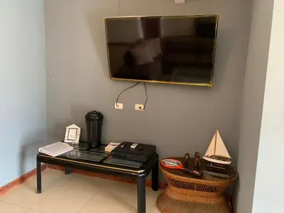 a mirror hanging on a wall above a table at Jaco Sol Quadplex 11A in Jacó