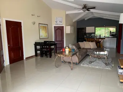 a living room with a couch and a table at Jaco Sol Quadplex 11A in Jacó